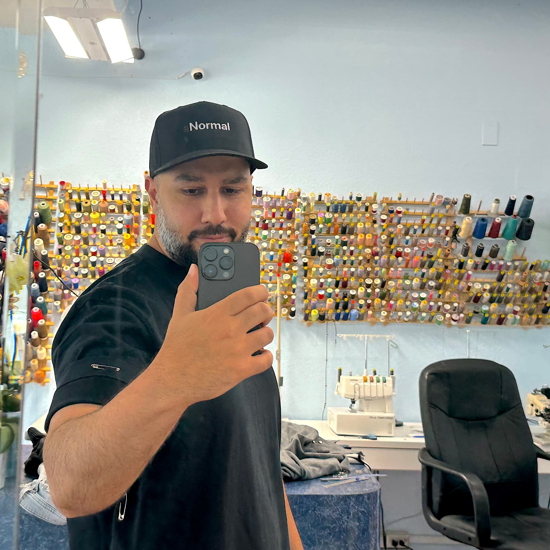Delmade founder in the workshop wearing the black tee