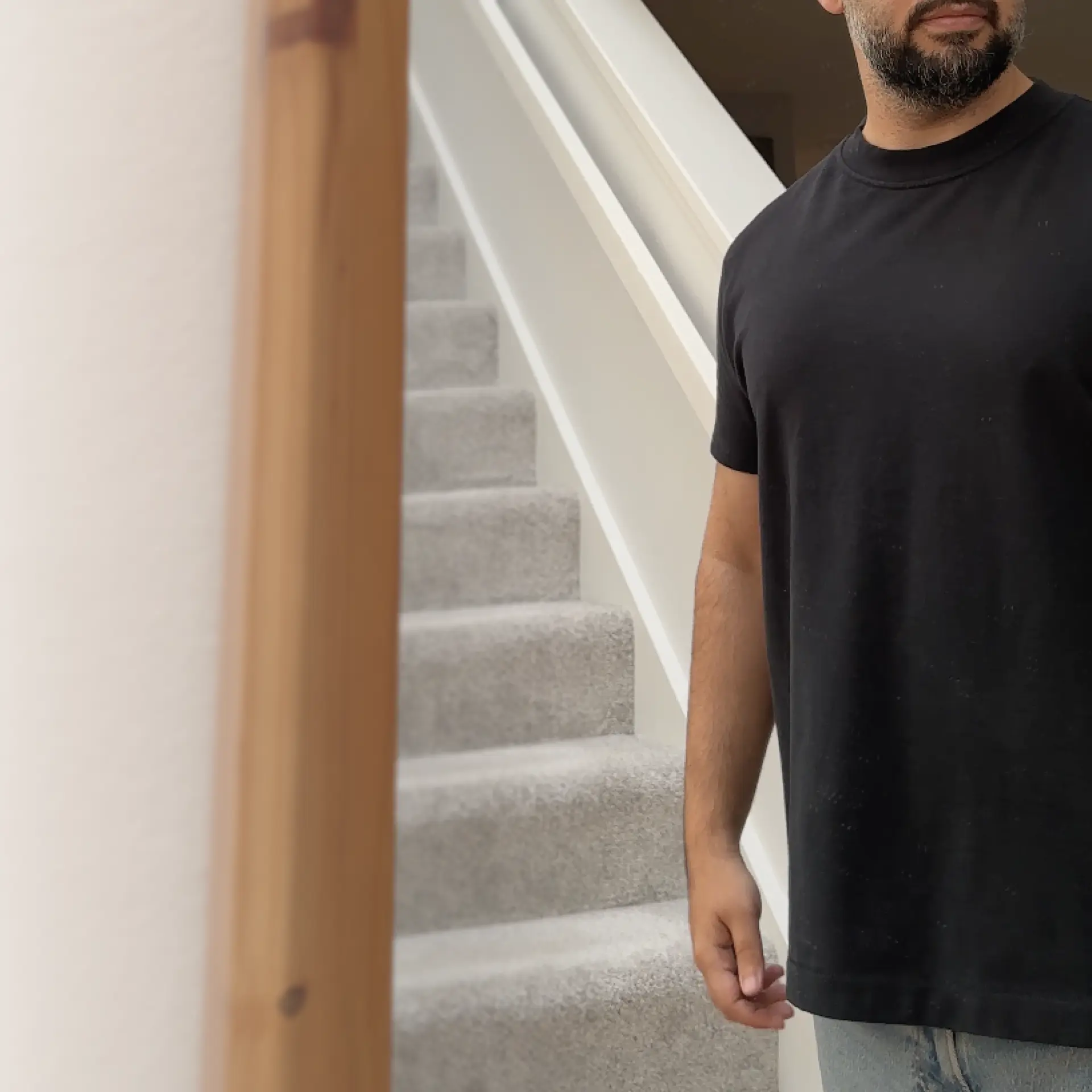 Man wearing the Delmade T-shirt, three-quarter view