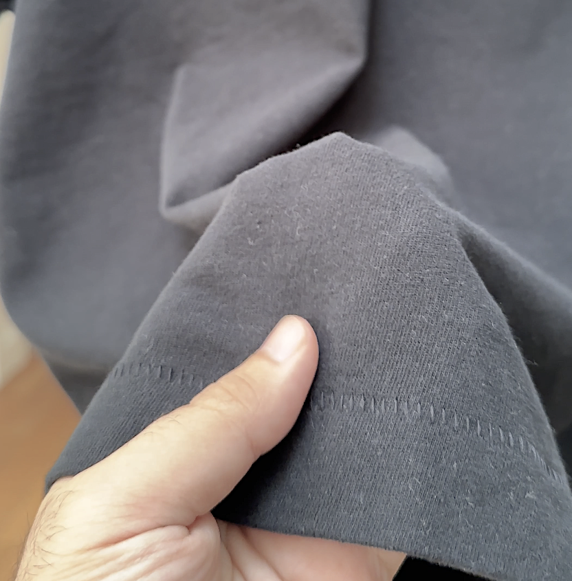 Close-up of the heavyweight cotton draping over a hand